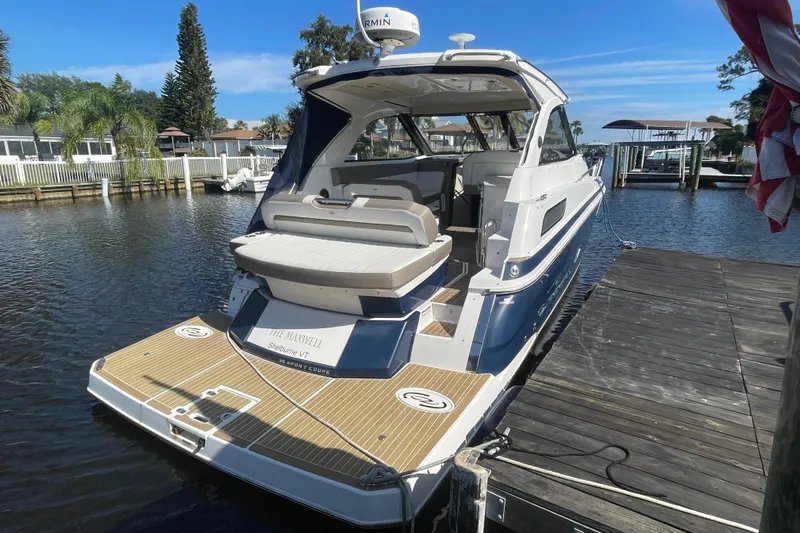  Yacht Photos Pics 2017 Regal 35 Sport Coupe docked, showcasing sleek design and spacious deck.