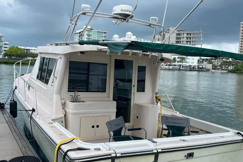  Yacht Photos Pics 2004 Albin 35 Tournament Express docked, featuring spacious deck and modern amenities.