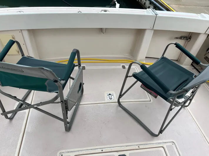  Yacht Photos Pics Two folding chairs on the deck of a 2004 Albin 35 Tournament Express boat.
