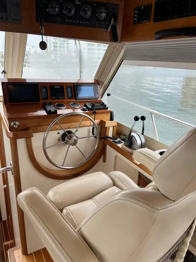  Yacht Photos Pics 2004 Albin 35 Tournament Express helm with leather seat and navigation controls.