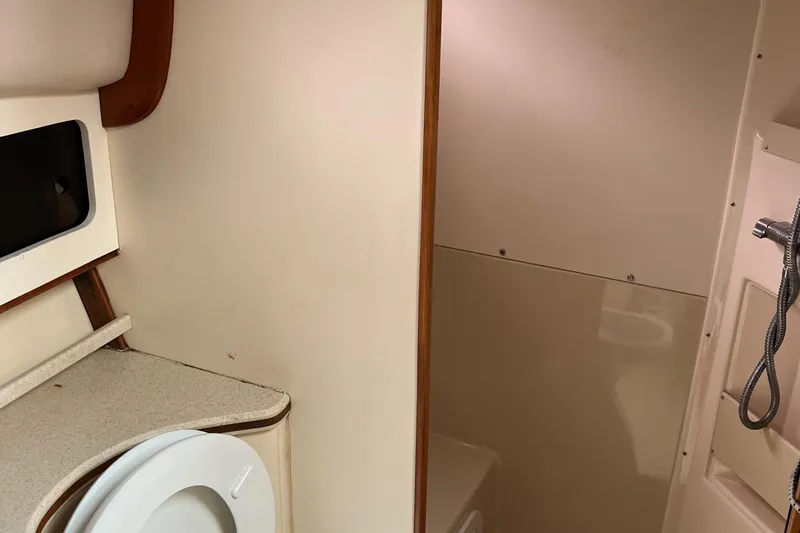  Yacht Photos Pics 2004 Albin 35 Tournament Express bathroom interior with shower and toilet.