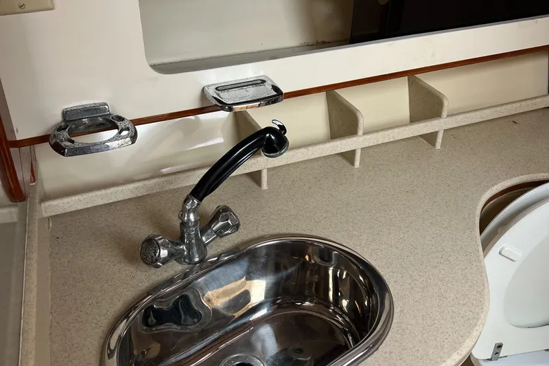  Yacht Photos Pics 2004 Albin 35 Tournament Express boat interior with sink and faucet.