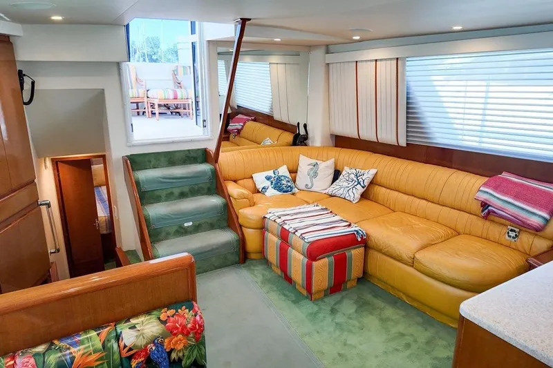 Coming To Fort Lauderdale By Nov. 3 Yacht Photos Pics Luxurious interior of 1999 Viking Cockpit Sports Yacht with plush seating and vibrant decor.