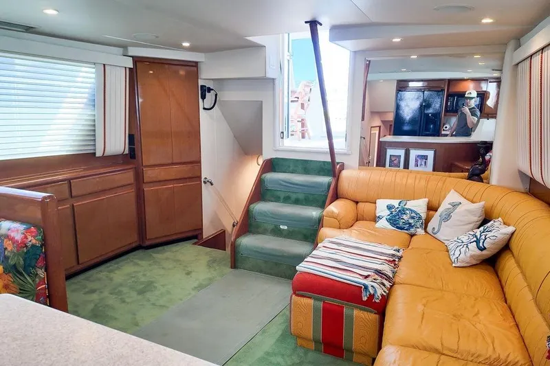 Coming To Fort Lauderdale By Nov. 3 Yacht Photos Pics Luxurious interior of a 1999 Viking Cockpit Sports Yacht with cozy seating and elegant decor.