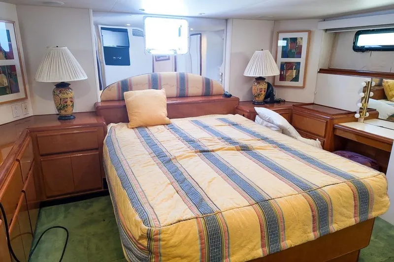 Coming To Fort Lauderdale By Nov. 3 Yacht Photos Pics Luxurious bedroom interior of 1999 Viking Cockpit Sports Yacht with elegant decor.
