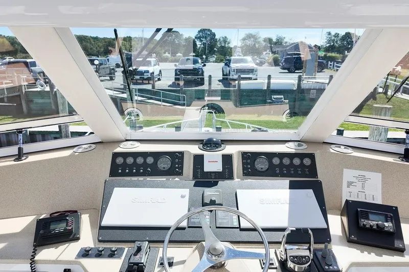 Coming To Fort Lauderdale By Nov. 3 Yacht Photos Pics Cockpit view of a 1999 Viking Cockpit Sports Yacht with navigation instruments.