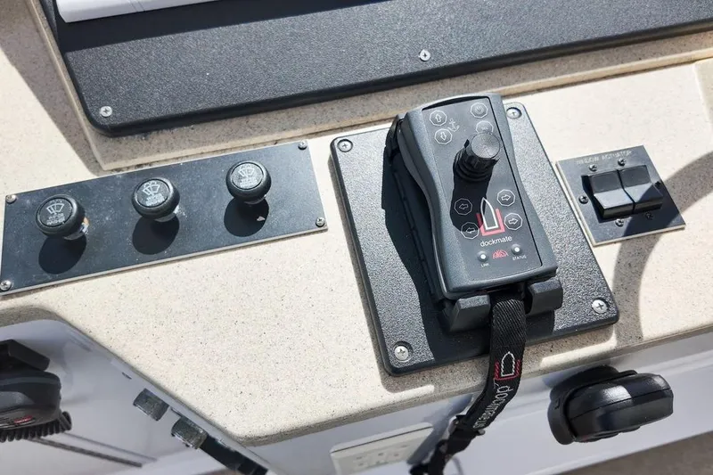 Coming To Fort Lauderdale By Nov. 3 Yacht Photos Pics Control panel of a 1999 Viking Cockpit Sports Yacht with joystick and switches.