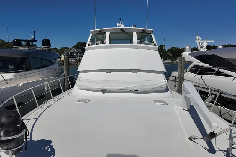 Coming To Fort Lauderdale By Nov. 3 Yacht Photos Pics 1999 Viking Cockpit Sports Yacht docked, showcasing sleek design and spacious deck.