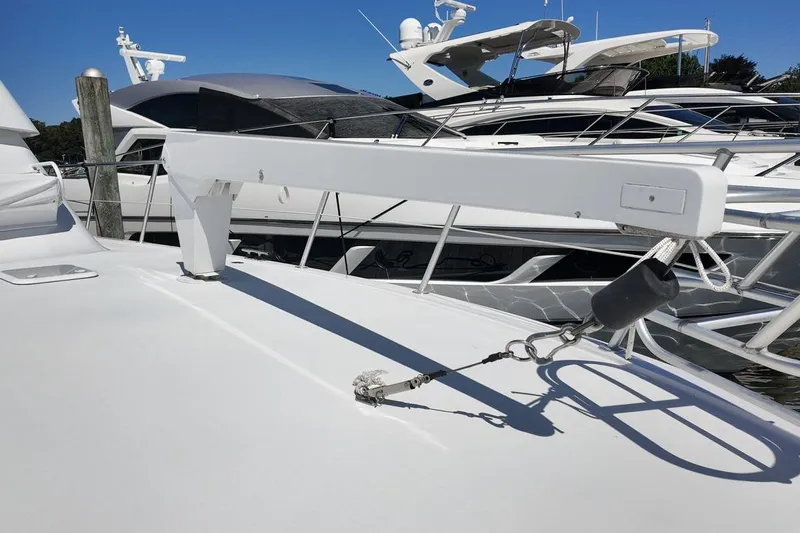 Coming To Fort Lauderdale By Nov. 3 Yacht Photos Pics 1999 Viking Cockpit Sports Yacht deck with mooring equipment and neighboring yachts.