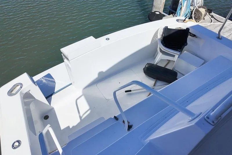 Coming To Fort Lauderdale By Nov. 3 Yacht Photos Pics 1999 Viking Cockpit Sports Yacht with white deck and seating area by the water.