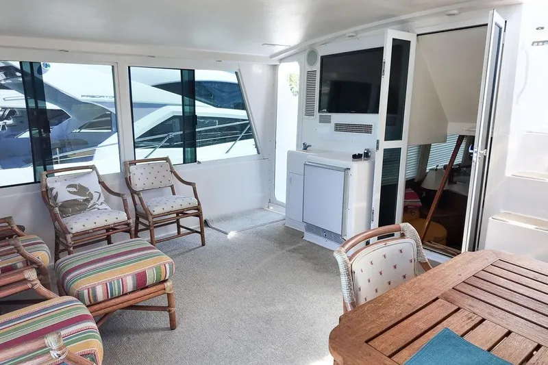 Coming To Fort Lauderdale By Nov. 3 Yacht Photos Pics Luxurious interior of 1999 Viking Cockpit Sports Yacht with elegant seating and modern amenities.