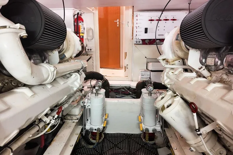 Coming To Fort Lauderdale By Nov. 3 Yacht Photos Pics Engine room of a 1999 Viking Cockpit Sports Yacht, showcasing dual engines and equipment.