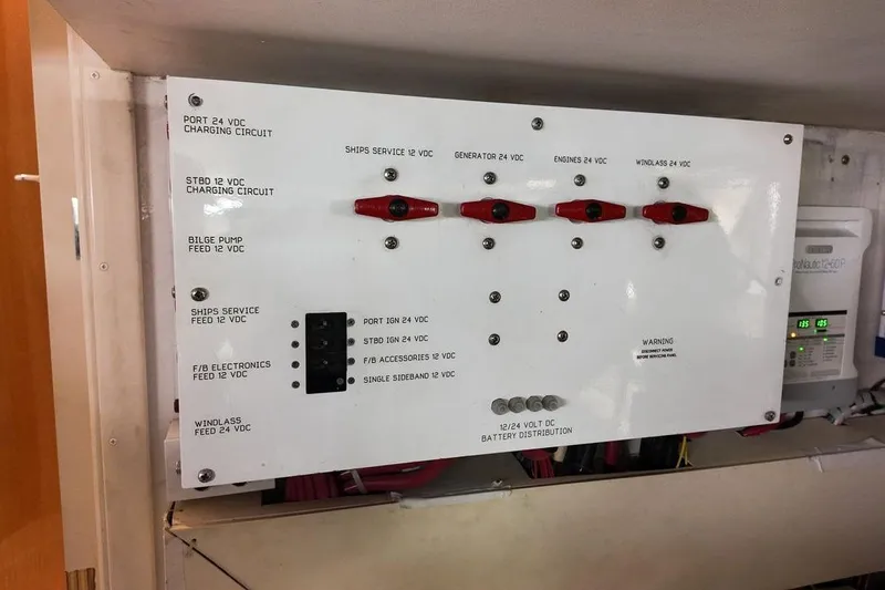 Coming To Fort Lauderdale By Nov. 3 Yacht Photos Pics Electrical panel on a 1999 Viking Cockpit Sports Yacht, showing battery distribution and circuit controls.
