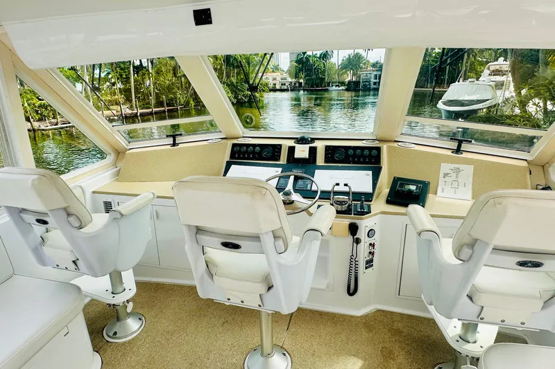 Coming To Fort Lauderdale By Nov. 3 Yacht Photos Pics 1999 Viking Cockpit Sports Yacht interior with helm, steering wheel, and navigation controls.