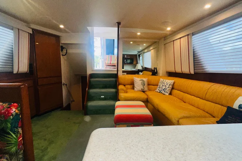 Least Expensive In The World Yacht Photos Pics Luxurious interior of a 1999 Viking Cockpit Sports Yacht with plush seating and modern decor.