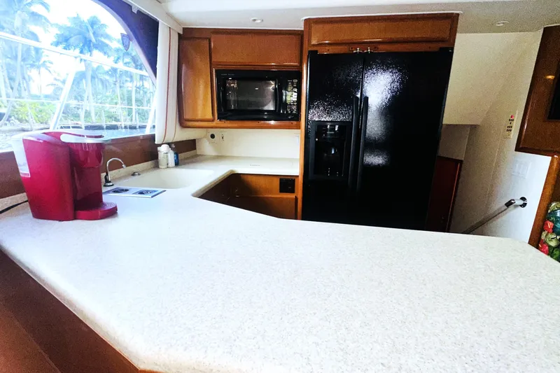 Least Expensive In The World Yacht Photos Pics Interior of 1999 Viking Cockpit Sports Yacht kitchen with modern appliances.