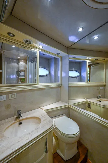  Yacht Photos Pics Luxurious bathroom in 2000 Pershing 65 Limited yacht with elegant fixtures and mirrors.