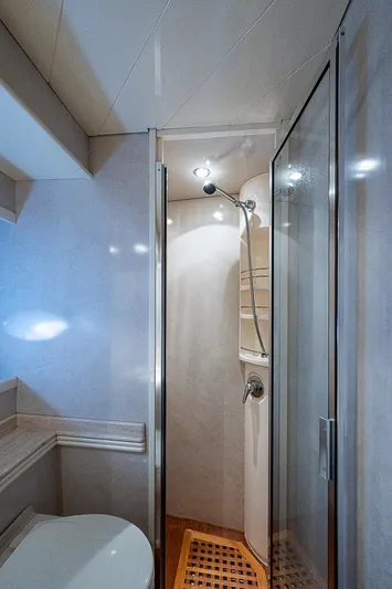  Yacht Photos Pics Bathroom interior of 2000 Pershing 65 Limited yacht with shower and modern fixtures.