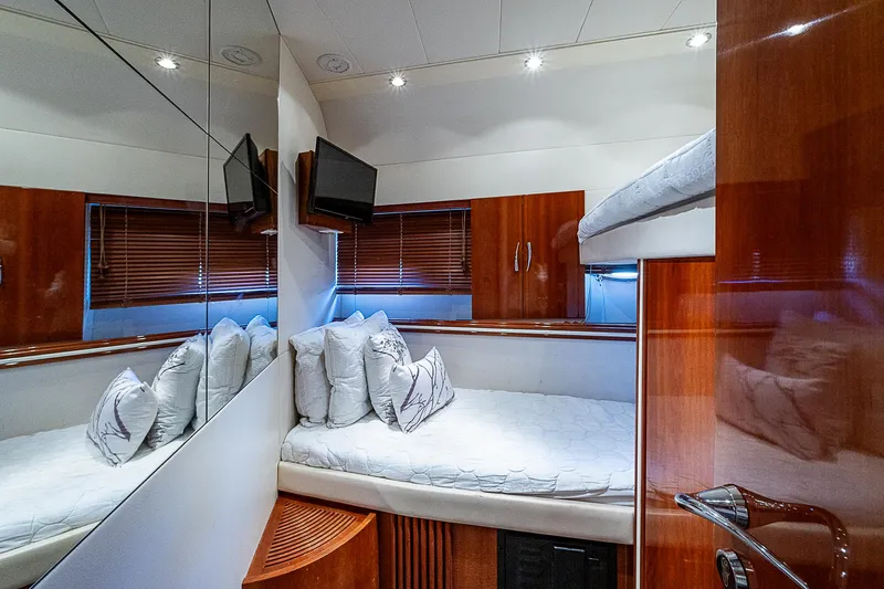  Yacht Photos Pics Luxurious cabin interior of 2000 Pershing 65 Limited yacht with modern amenities.