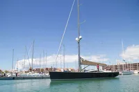 2007 Comar Comet 62 RS yacht docked in a marina under clear blue skies.