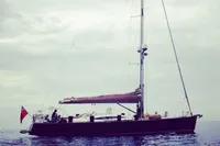 Sailing yacht Comar Comet 62 RS, 2007 model, on calm sea under cloudy sky.
