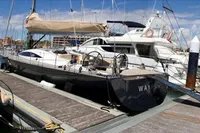 Sailing yacht Comar Comet 62 RS, 2007 model, docked at a marina.