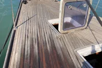 Deck of 2007 Comar Comet 62 RS yacht with open hatches in a marina.