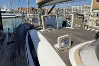 2007 Comar Comet 62 RS sailboat docked in a marina, showcasing deck and hatches.