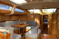 Luxurious interior of 2007 Comar Comet 62 RS yacht with wood finish and skylights.