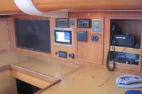 Navigation panel inside 2007 Comar Comet 62 RS yacht with electronic equipment and wood finish.