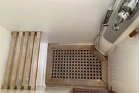 Wooden shower floor and bench in 2007 Comar Comet 62 RS yacht bathroom.