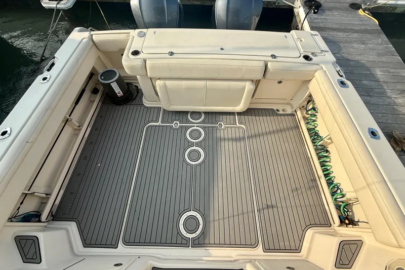  Yacht Photos Pics 2016 Grady-White Express 330 boat deck with seating and fishing equipment.