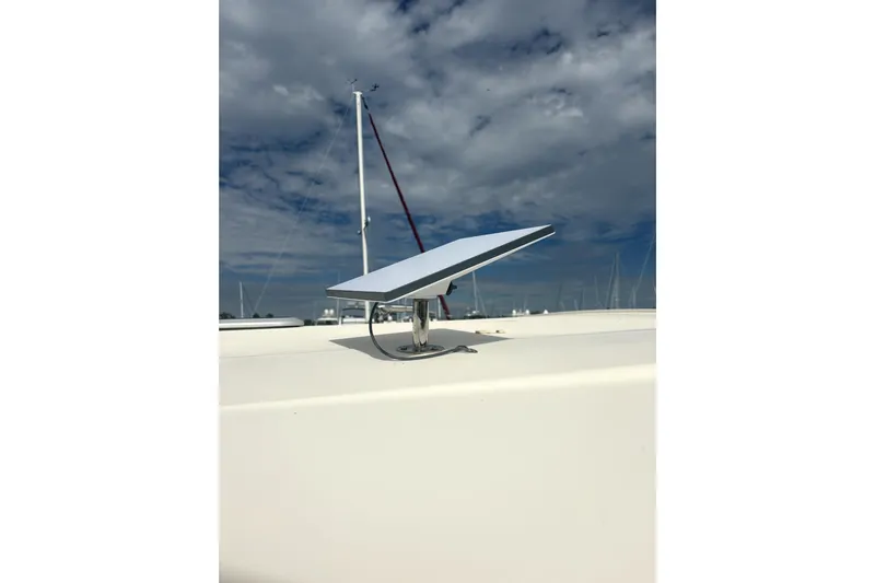  Yacht Photos Pics Satellite dish on 2016 Grady-White Express 330 boat under cloudy sky.