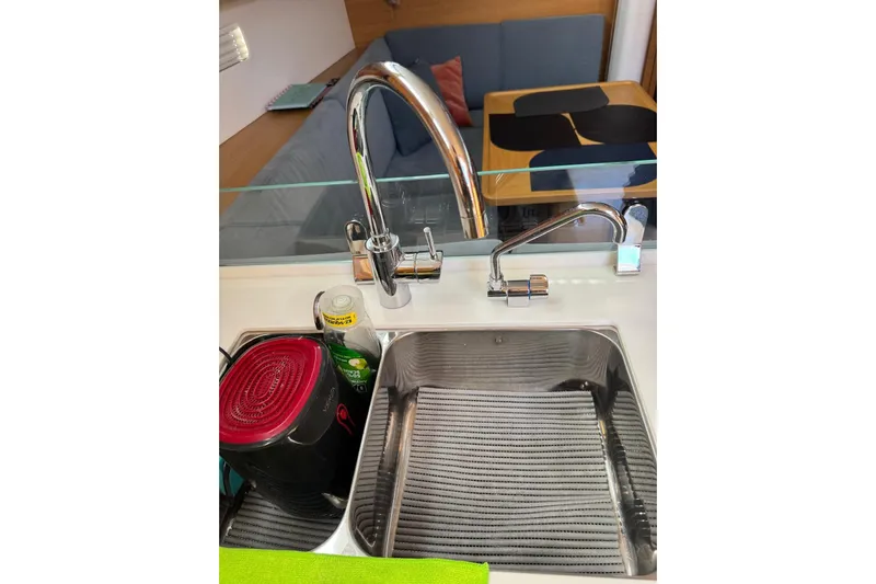 Build No.31 Yacht Photos Pics Modern kitchen sink in 2021 X-Yachts 4.6, featuring sleek faucet and drying rack.