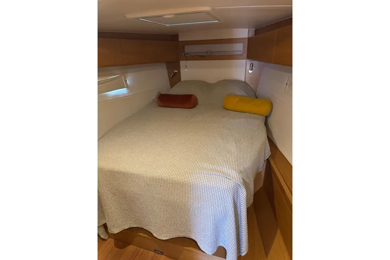 Build No.31 Yacht Photos Pics Cozy cabin interior of 2021 X-Yachts 4.6 with comfortable bedding and pillows.