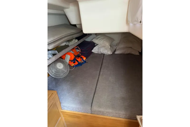 Build No.31 Yacht Photos Pics Cozy cabin interior of 2021 X-Yachts 4.6 with bedding and fan.