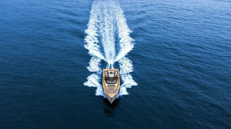  Yacht Photos Pics Aerial view of 2025 OKEAN 57 yacht cruising on open blue sea.