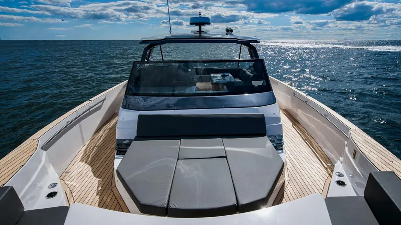  Yacht Photos Pics Luxury OKEAN 57 yacht cruising on open sea, 2025 model, under a partly cloudy sky.