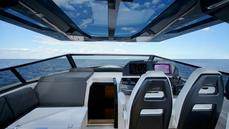  Yacht Photos Pics Luxurious 2025 OKEAN 57 yacht interior with panoramic ocean view and modern cockpit design.