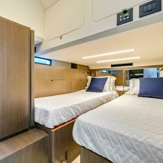  Yacht Photos Pics Modern twin cabin interior in 2025 OKEAN 57 yacht, featuring sleek design and ambient lighting.