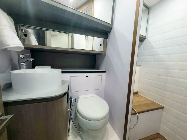  Yacht Photos Pics Modern bathroom in 2025 OKEAN 57 yacht, featuring sleek fixtures and minimalist design.