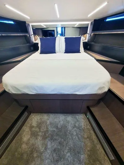  Yacht Photos Pics Luxurious bedroom interior of 2025 OKEAN 57 yacht with modern design and cozy bedding.