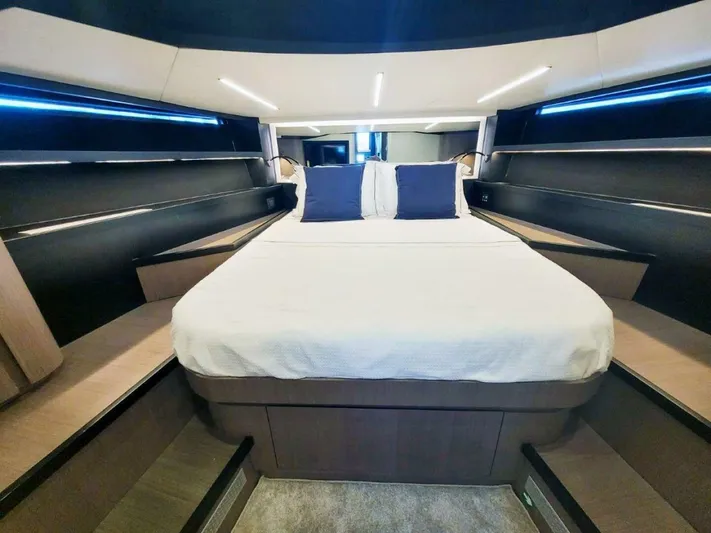  Yacht Photos Pics Luxurious cabin interior of 2025 OKEAN 57 yacht with modern bedding and ambient lighting.