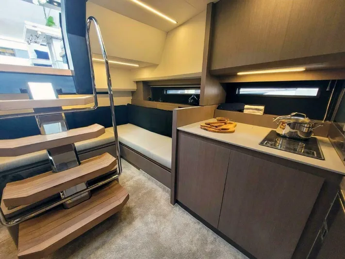  Yacht Photos Pics Modern interior of 2025 OKEAN 57 yacht with sleek kitchen and stylish staircase.