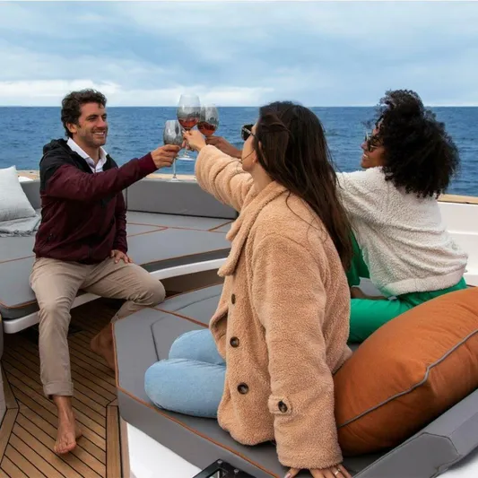  Yacht Photos Pics People enjoying a toast on a 2025 OKEAN 57 yacht at sea.