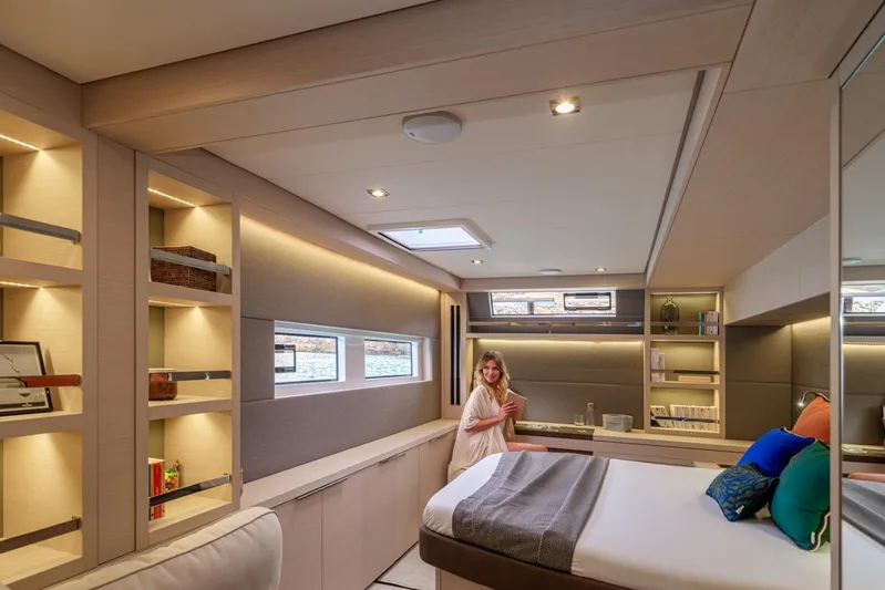  Yacht Photos Pics Luxurious interior of 2026 Lagoon 55 yacht with modern design and cozy bedroom.
