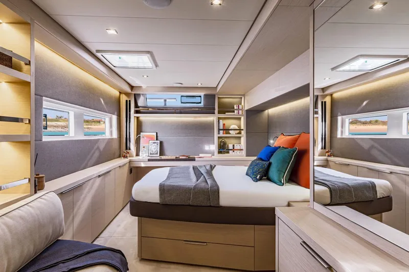  Yacht Photos Pics Luxurious interior of 2026 Lagoon 55 yacht with modern bedroom design and elegant decor.