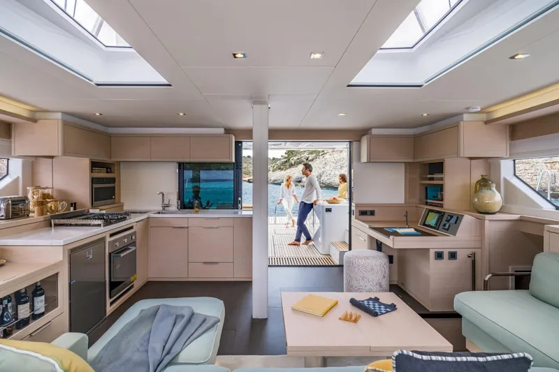 Yacht Photos Pics Luxurious interior of 2026 Lagoon 55 yacht with modern kitchen and spacious living area.