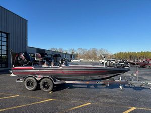 2022 Bass Cat Cougar FTD boat on trailer in parking lot, clear blue sky.