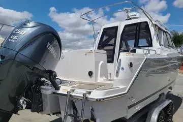  Yacht Photos Pics 2023 Cutwater C-248 Coupe boat with Yamaha V6 engine, docked under blue sky.